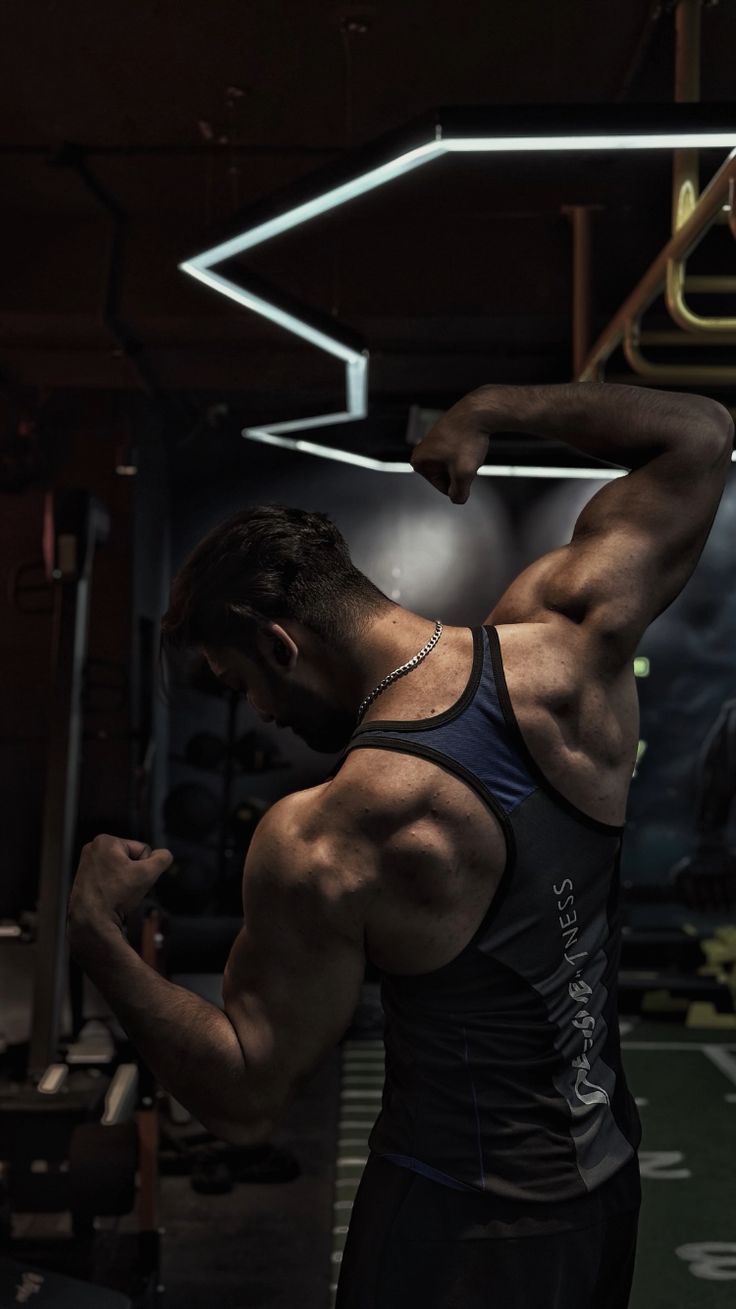 Athlete flexing in a gym